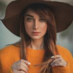 Woman Wearing Orange Sweater